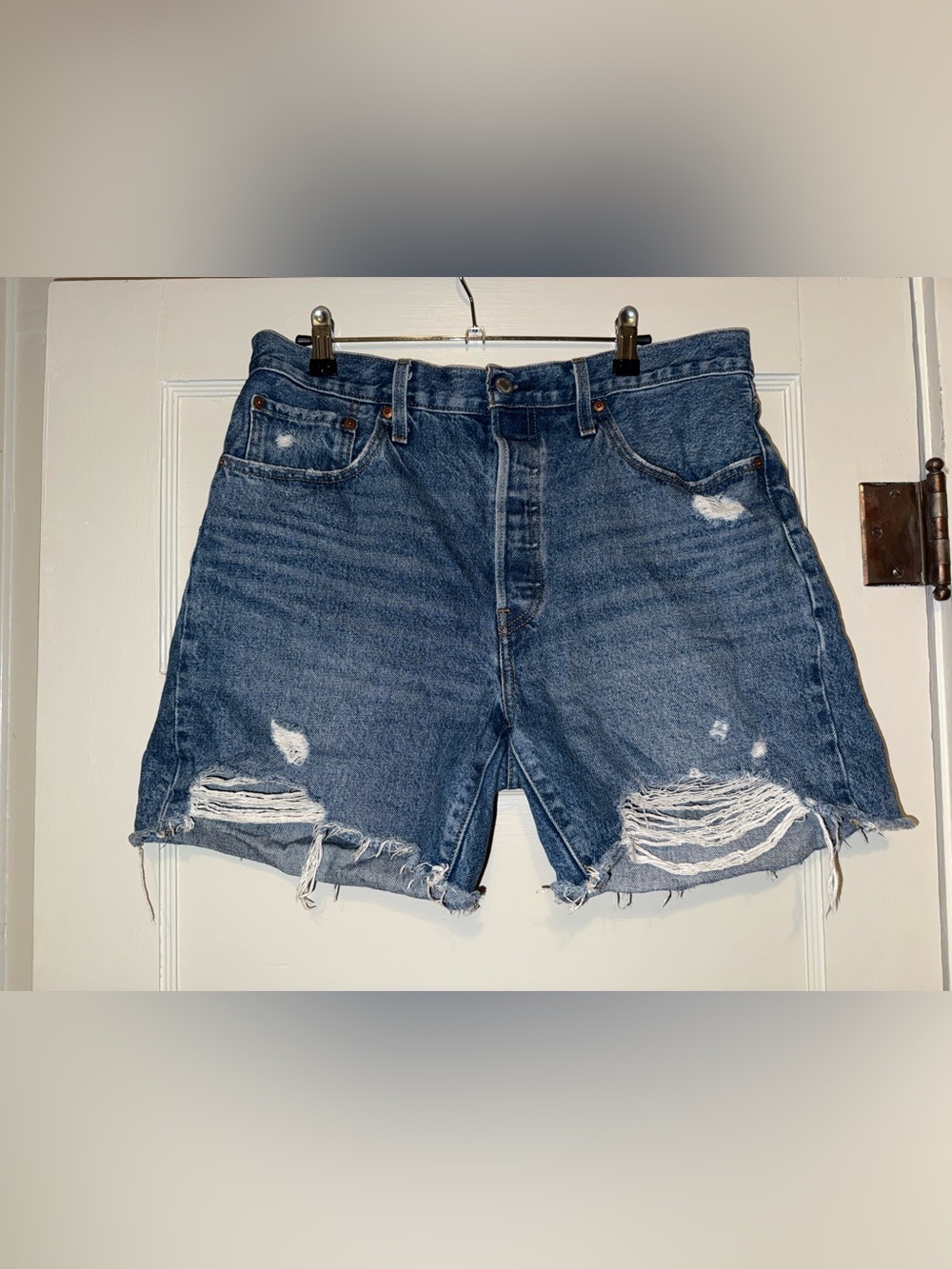 Levi’s high rise button fly denim distressed shorts